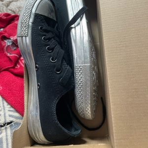 Black converse with silver sole and sides . Size 7